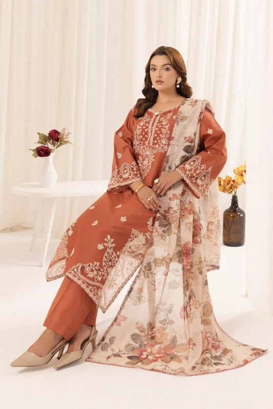 Woman wearing a floral and rust-colored traditional outfit with a white background