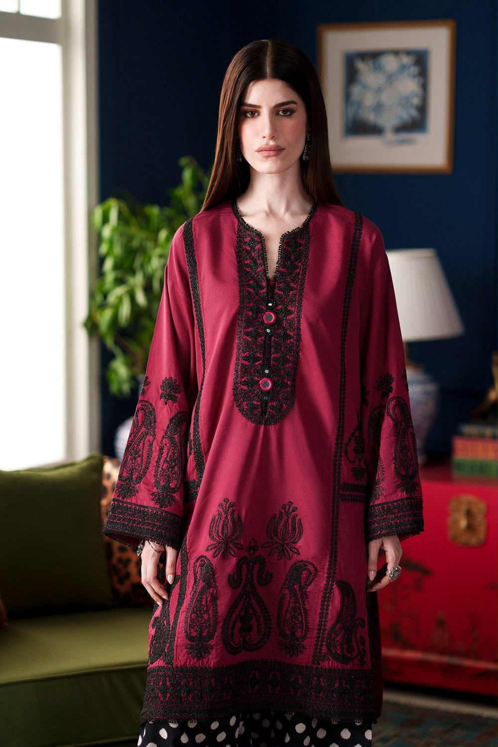 Ethnic deep red Shamoze silk suit with black neckline embroidery and polka dot printed trousers.   