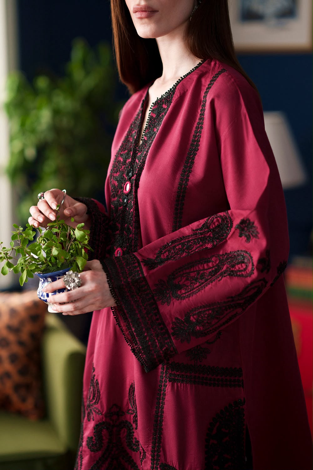 Ethnic deep red Shamoze silk suit with black neckline embroidery and polka dot printed trousers.   