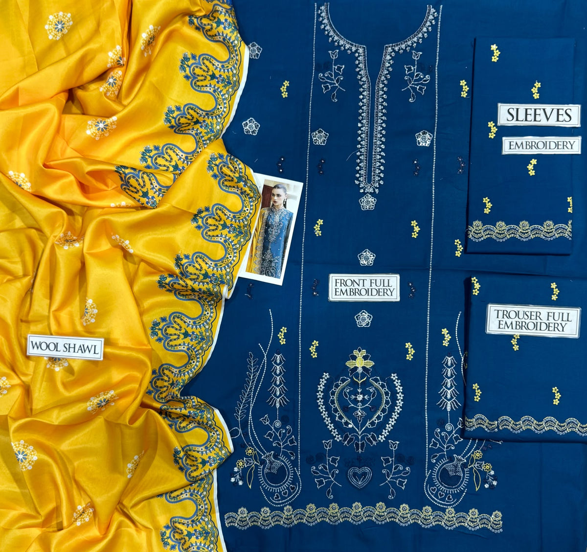 Royal blue embroidered Dhanak shirt and trouser with a contrasting mustard yellow digital printed wool shawl.