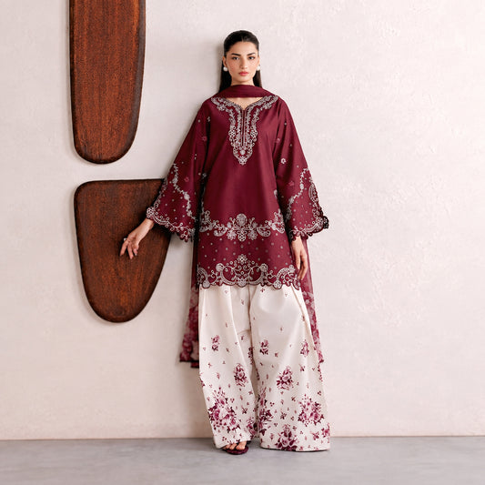 Iznik NF-448 unstitched 3-piece suit featuring embroidered Shamoze silk shirt and floral printed Apple Silk dupatta in deep maroon and classic blue.