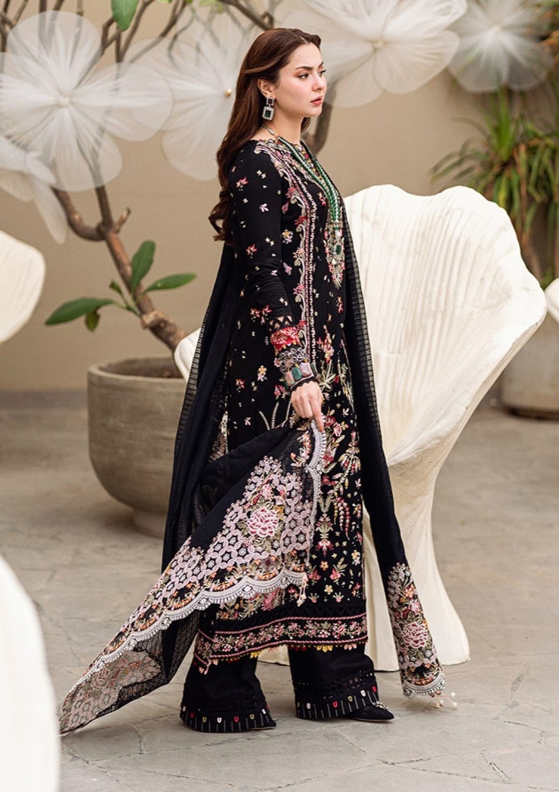 Qalamkar black Dhanak 3 piece suit featuring colorful embroidery and an embroidered Dhanak shawl.   