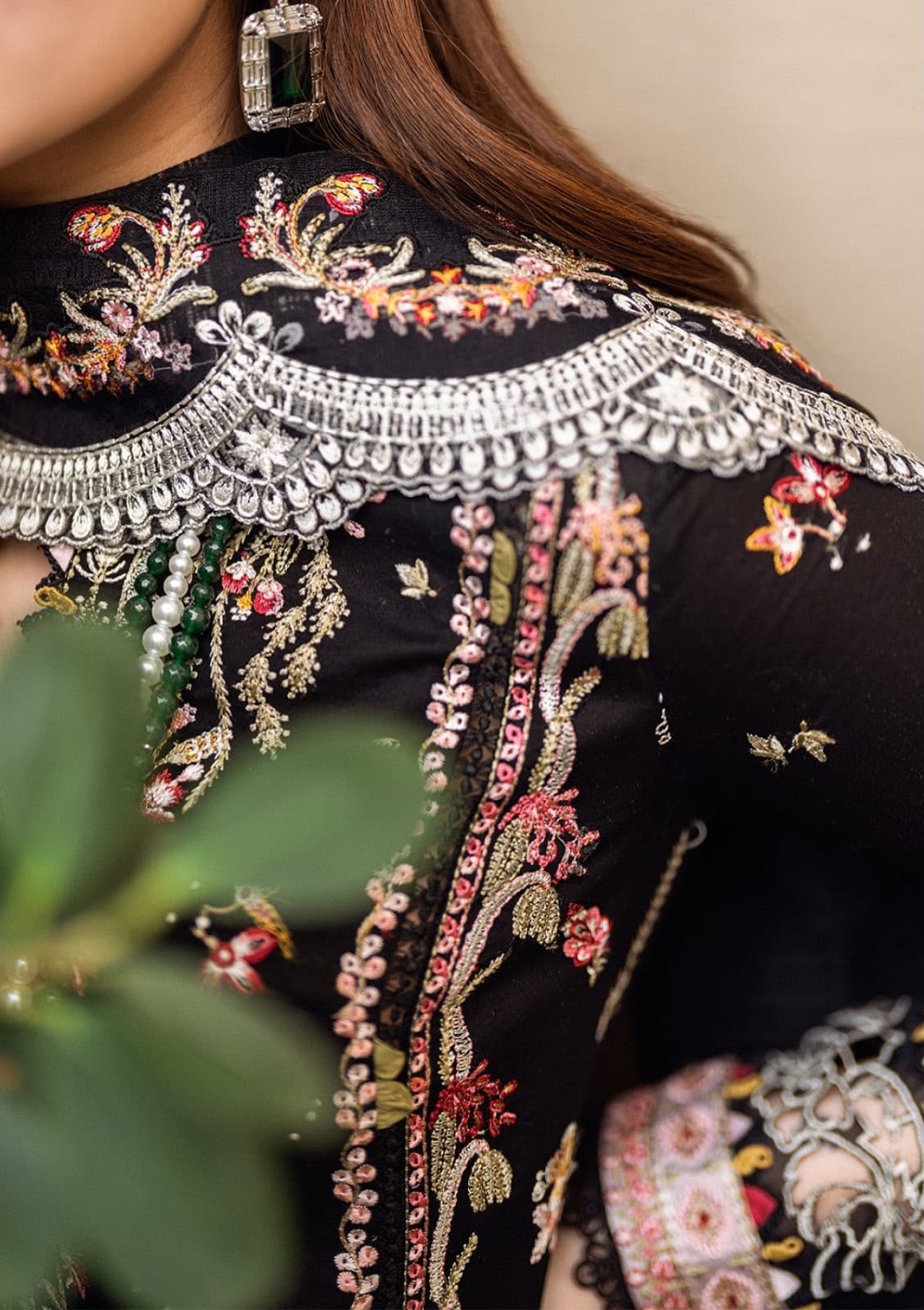 Qalamkar black Dhanak 3 piece suit featuring colorful embroidery and an embroidered Dhanak shawl.   