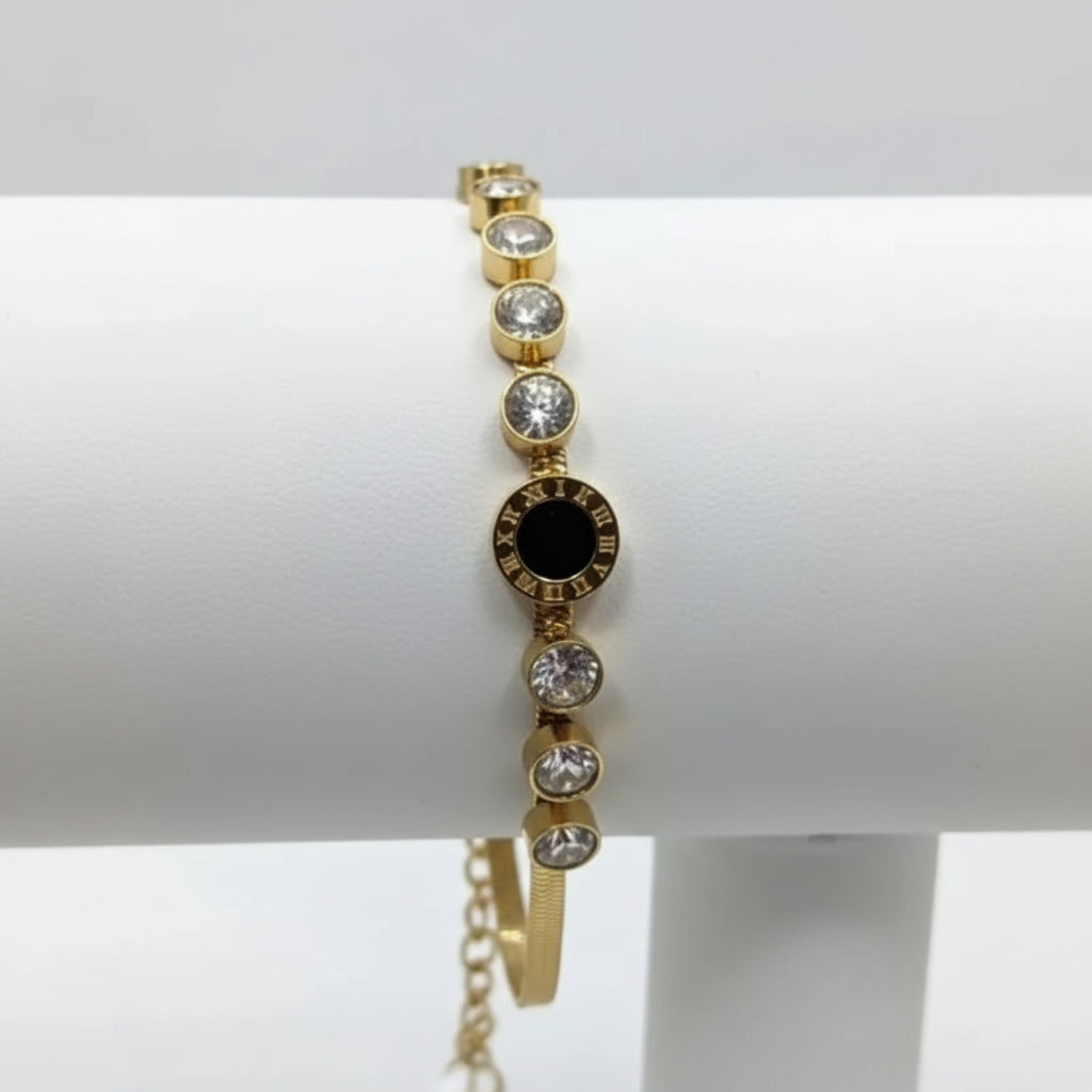 Gold bracelet with gemstones on a white background
