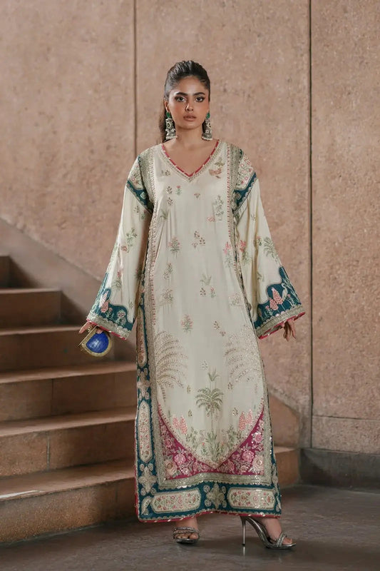 Woman in a traditional embroidered dress standing on a staircase.