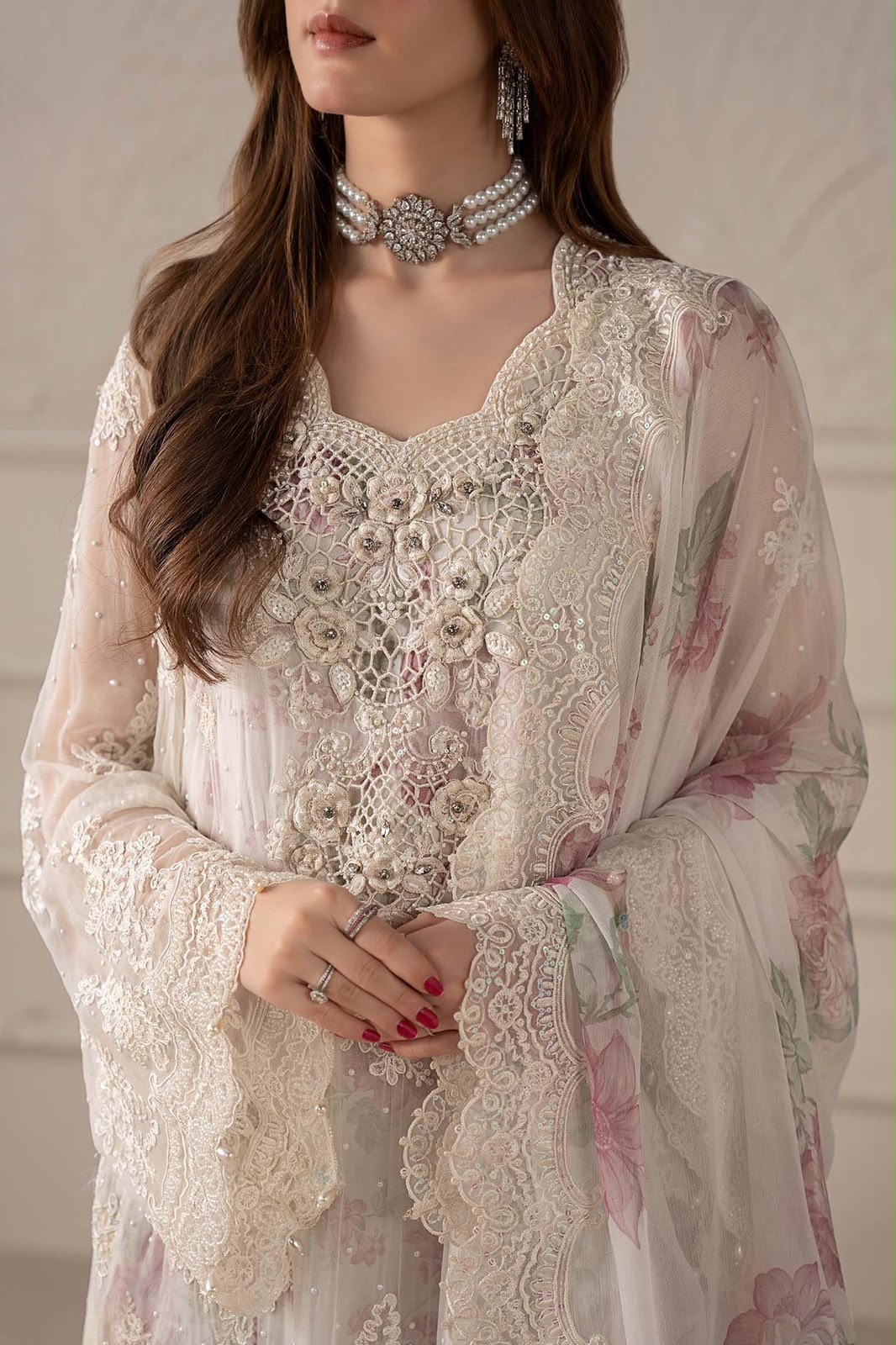 Maria B off-white floral embroidered chiffon shirt with Adda handwork and digital printed silk trouser.   