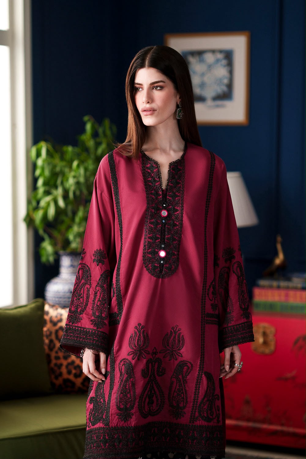 Ethnic deep red Shamoze silk suit with black neckline embroidery and polka dot printed trousers.   