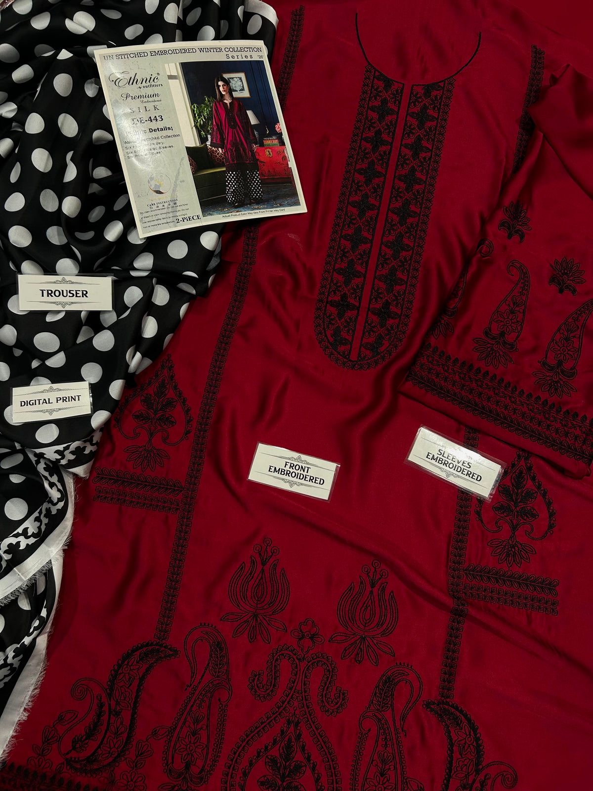 Ethnic deep red Shamoze silk suit with black neckline embroidery and polka dot printed trousers.   