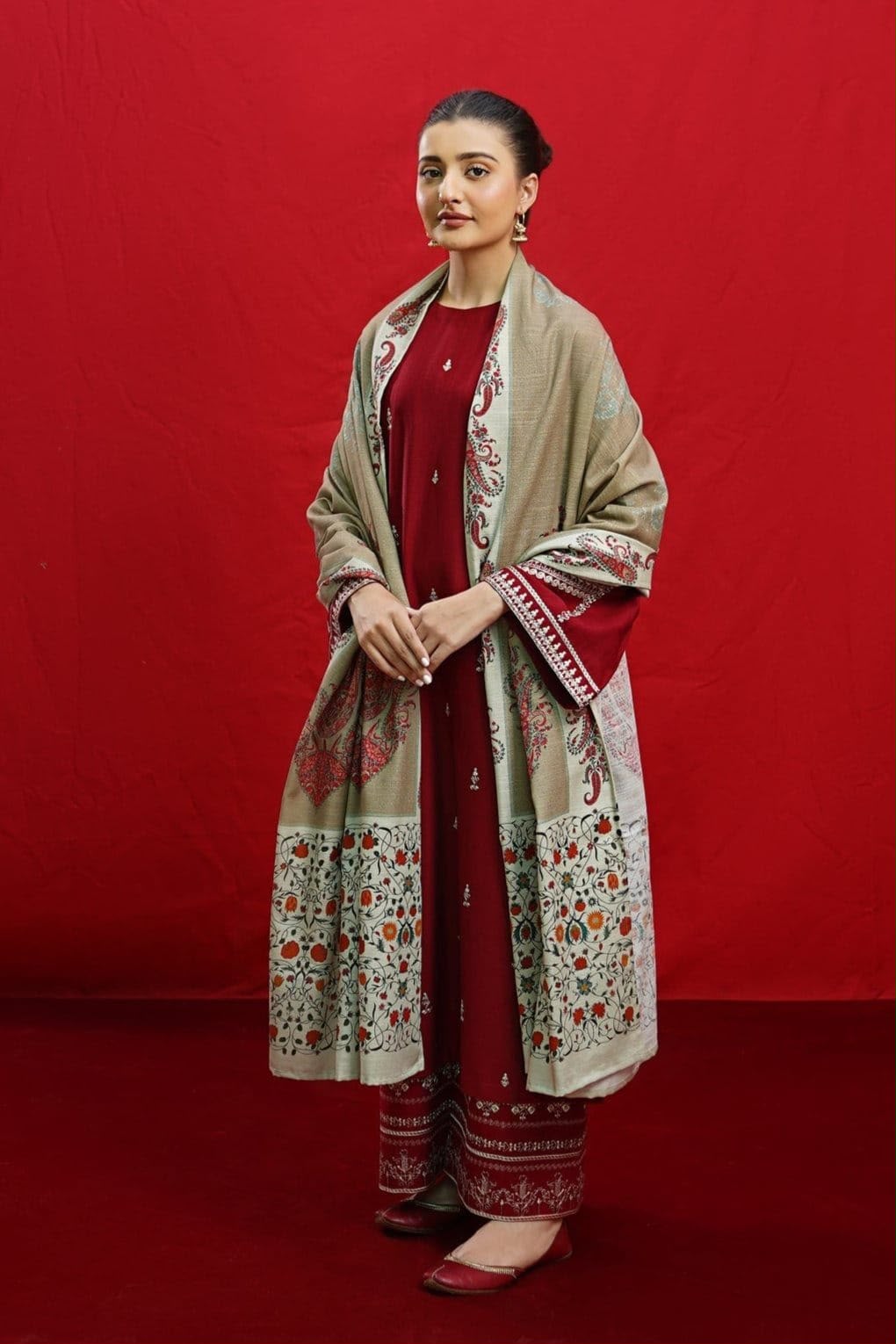 Woman wearing a traditional outfit with a red background